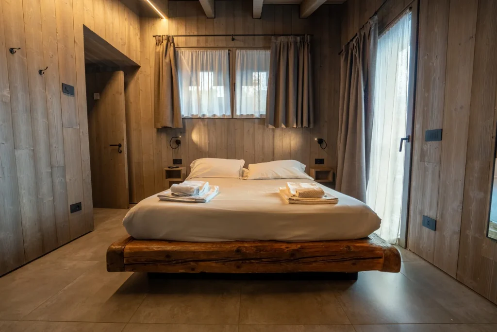 Letto della camera King Doppia a Ponte di Legno
